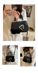 Detail view of black glitter saddle bag with gold D-buckle shown in multiple wearing styles