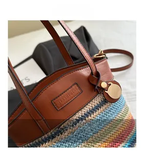 Detailed view of the colorful woven texture with a brown leather JIASHI QING logo label