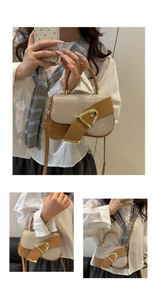 Detail of light brown saddle bag with glitter woven flap and golden D-buckle decoration