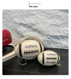 Close-up of cream rugby cylinder bag with black leather stripes and gold chain strap
