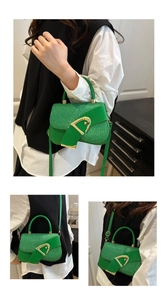 Green textured leather square bag with gold buckle shown in hand and crossbody styles