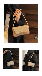 Detail of beige baguette bag with gold sequins showing adjustable knotted shoulder strap