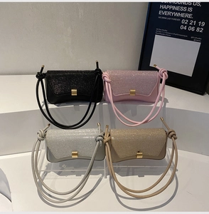 Glittery baguette bags with knotted shoulder straps and gold buckles in four colors