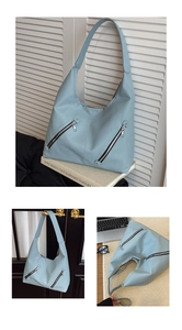 Detail of light blue lychee pattern leather hobo bag with trendy double zipper pockets