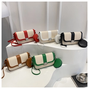 Detailed view of color-block woven saddle bags in five colors with matching mini pouches