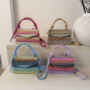 Chic woven crossbody bag in colorful wave patterns and elegant neutral textures