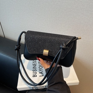 Elegant black glitter baguette shoulder bag with gold square buckle and knotted strap