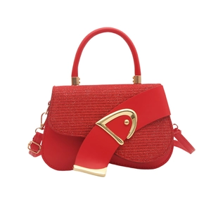 Elegant red saddle bag with glitter flap, gold buckle, and adjustable crossbody strap