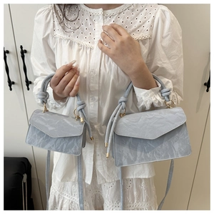 Detailed comparison of large and mini light blue pleated PU leather crossbody handbags
