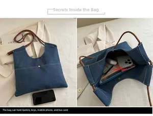 Detail of denim tote bag showing spacious interior compartment and thick rope straps