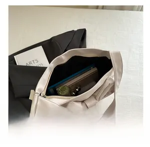 Interior view showing the large storage capacity for daily items in the bow shoulder bag