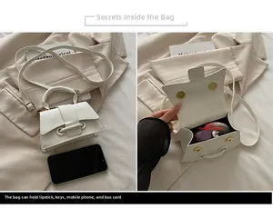 Detailed view of white litchi pattern crossbody bag showing internal capacity and size