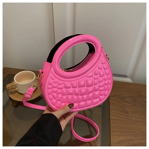 Detailed view of a bright pink dopamine-style PU handbag with a round cutout handle