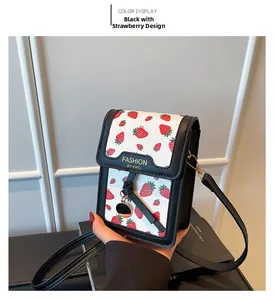 Detailed view of French vintage floral crossbody bag with strawberry print and gold hardware