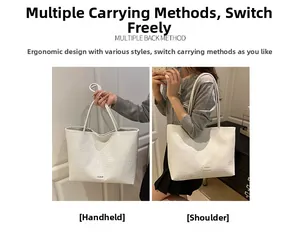 White large tote bag with embossed texture showing handheld and shoulder carry options
