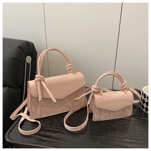 Pink textured leather handbag set with gold hardware and woven handles for women