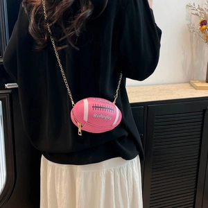 Pink rugby-shaped crossbody bag with gold chain strap and stylish letter engraving