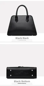 Detail of black leather handbag base with protective silver studs and bird logo stamp