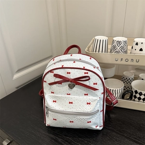 White PU leather mini backpack with red bow prints and heart charm for casual outings