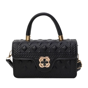 Chic black quilted handbag with elegant gold flower lock and top handle for women