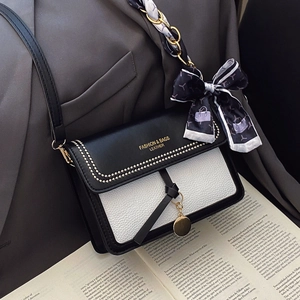 Retro black and white crossbody bag with decorative scarf and elegant chain strap