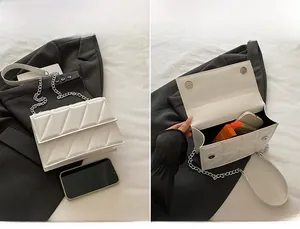 Detailed view of quilted square bag interior showing storage capacity for essentials