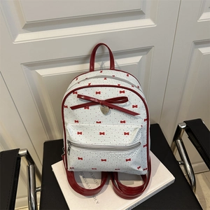Mini white backpack with red bow pattern and heart pendant for summer fashion