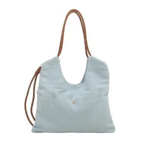 Light blue denim tote bag with brown rope handles and metal button front pocket