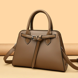 Brown textured leather tote bag with decorative buckle and dual handles for women