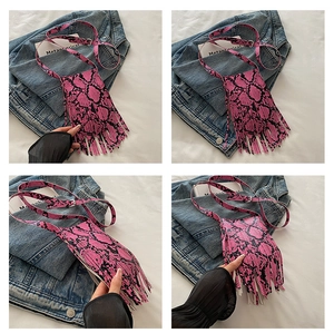 Multi-angle views of pink snakeskin pattern crossbody bag with long tassel details