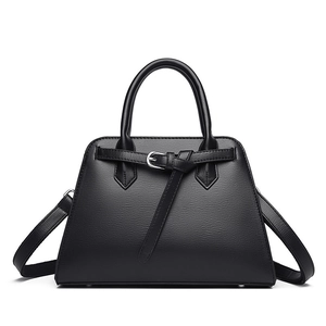 Minimalist black pebbled leather tote bag with silver hardware and detachable strap