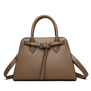 Fashionable dark brown leather handbag for women with dual handles and crossbody strap
