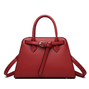 Elegant red trapezoid handbag in cross-grain leather with silver buckle and top handles