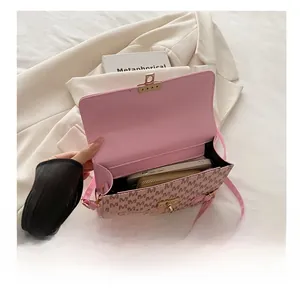 Internal view of pink monogram handbag showing space for phone and wallet