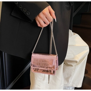 Chic metallic pink mini crossbody bag with crocodile texture and silver chain strap