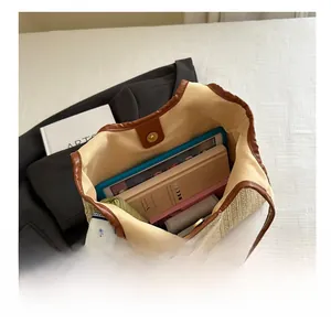 Macro view of woven straw tote bag interior with large capacity for laptop and books