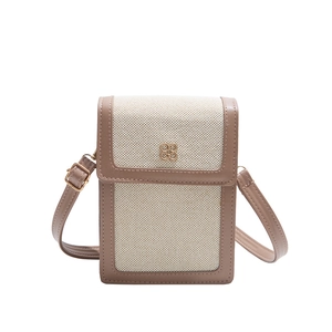 Minimalist canvas crossbody bag with brown leather trim and golden flower buckle