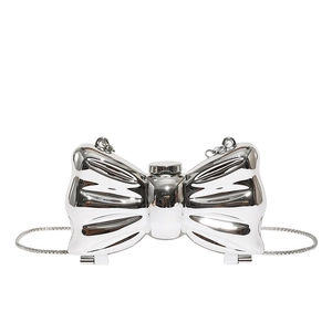 Silver mirror finish bow-shaped acrylic clutch bag with metallic chain strap