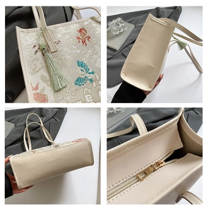 Detail of Chinese style tote bag with butterfly embroidery, tassels, and zip closure