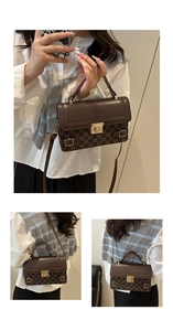 Detail view of brown patchwork small square bag with metal lock and monogram pattern
