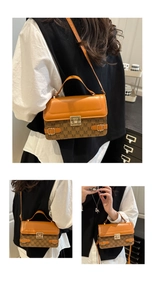 Detailed close-up of a women's vintage satchel with contrast leather and printed canvas
