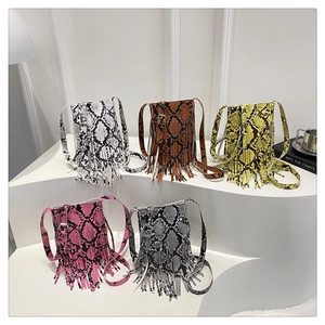 Detailed view of luxury snake pattern crossbody bags with elegant long tassels in five colors
