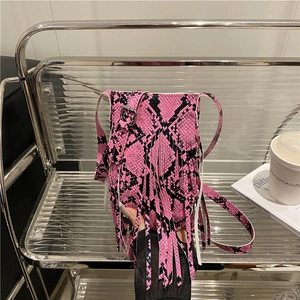 Pink and black snake print crossbody bag with long fringes and silver metal buckle