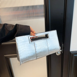 Elegant silver crocodile embossed clutch bag with metal handle for evening parties