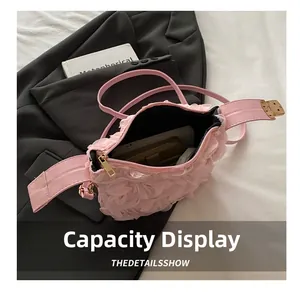 Pink floral layered mesh handbag showing interior capacity with phone and wallet