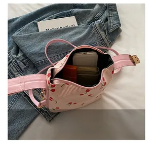 Internal view of cherry print shell bag showing space for phone, wallet and lipstick