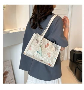 Chic white tote bag featuring Chinese koi pattern and soft tassel detail for daily use