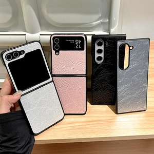 Textured leather folding phone case for Z Flip 6 in four colors on a wooden surface