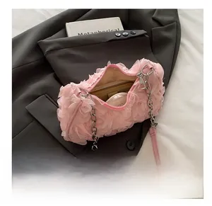 Internal capacity of pink floral evening clutch with wallet and makeup compact inside
