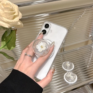 Clear phone case with white 3D floral pop-up grip and elegant pearl accessories